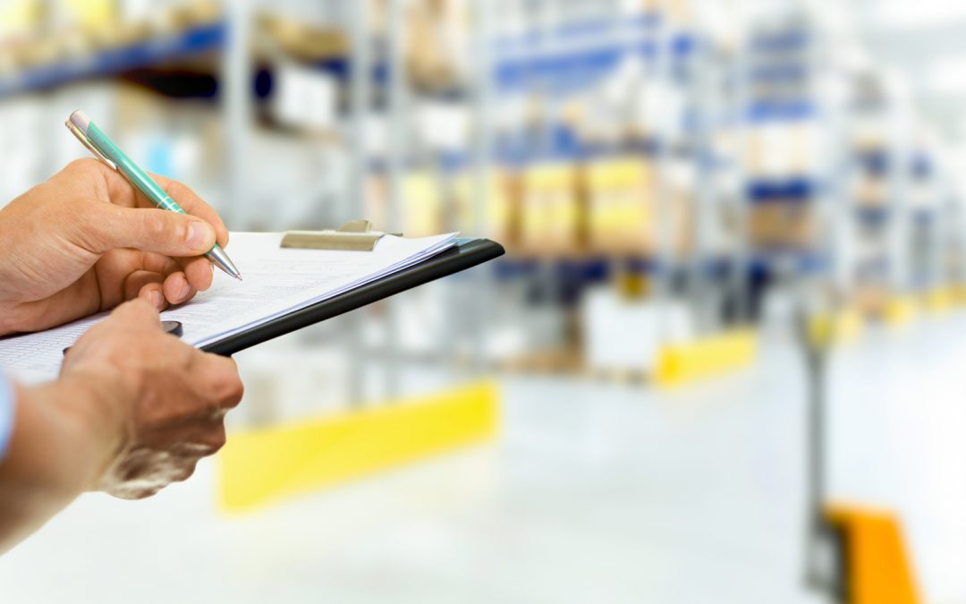 Man-Writing-on-Clipboard-in-Storage-Warehouse