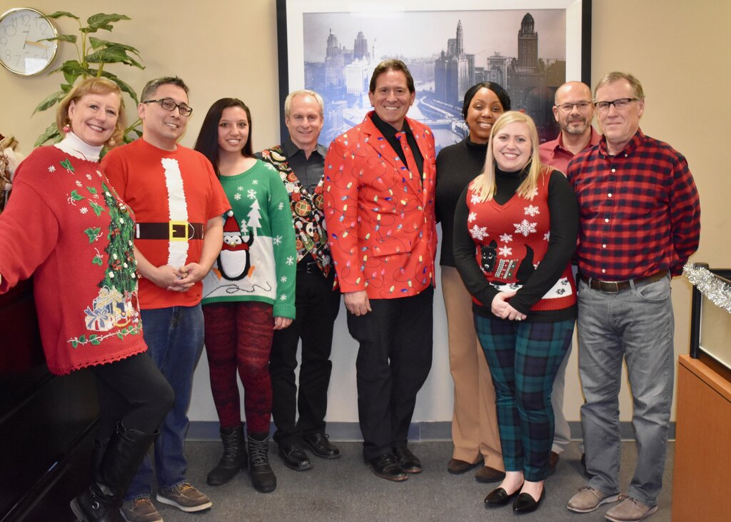 Mid-West Moving & Storage Team with Holiday Sweaters