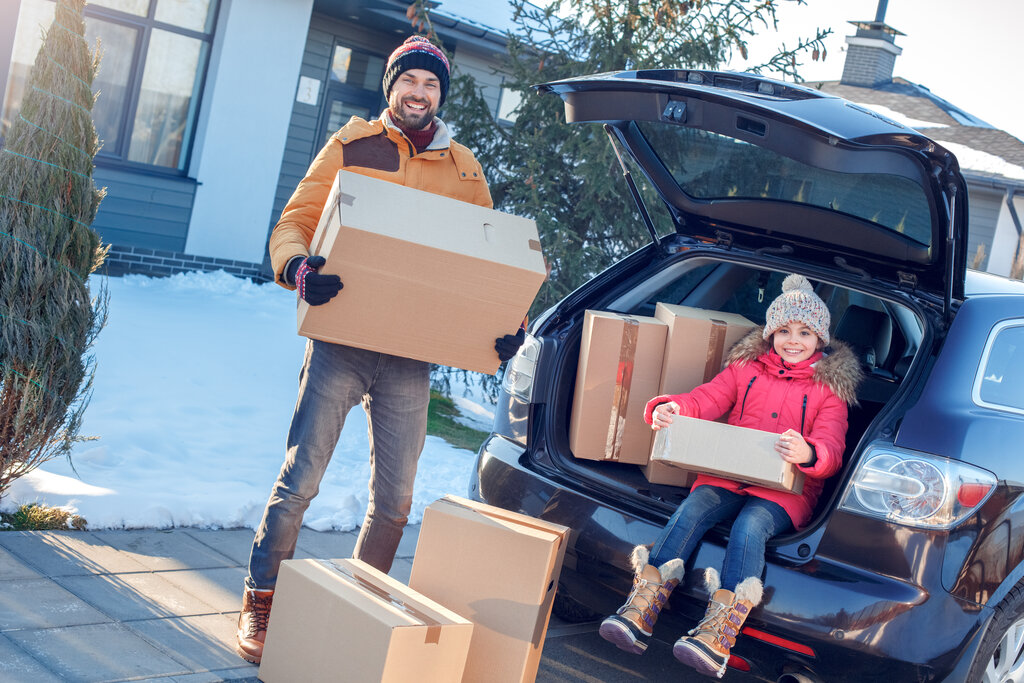 Family with Moving Boxes in Winter