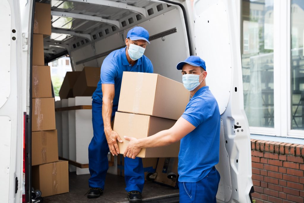 Men Unloading Cardboard Boxes