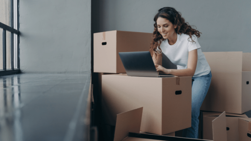 Woman looking up moving company